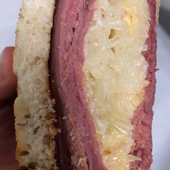 Grapes & Hops Deli - a hand holding a sandwich - Delis Near Me - San Diego, California Grapes & Hops Deli - a hand holding a sandwich - Delis Near Me - San Diego, California