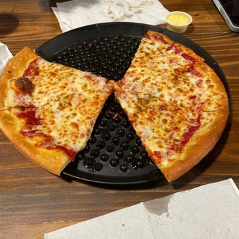 Union Hall - Pizza from Village Pizzaria. Some of the best pizza I've ever had. Couldn't wait to eat it for a picture - Food Court Near Me - Waco, Texas
