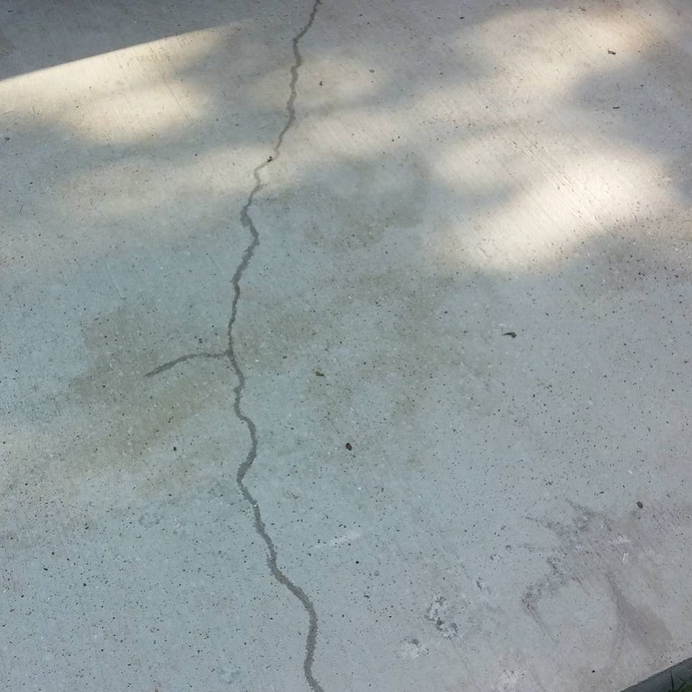 Image Remodeling & Repairs - a cracked concrete patio - General Contractors Near Me - Shreveport, Louisiana
