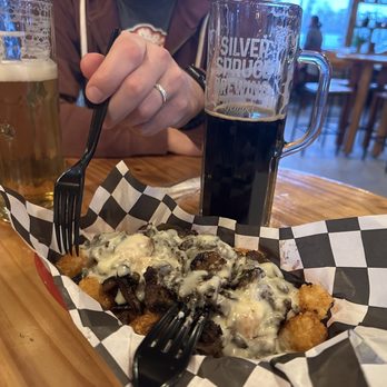 Bull and Bear Kitchen - a plate of food and a glass of beer - Food Trucks Near Me - Traverse City, Michigan