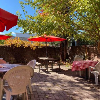Brasserie Le Bouchon Restaurants - Outdoor patio in back - French Near Me - Cold Spring, New York