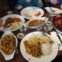 Manvirro's Indian Grill - Aloo gobi, Chana masala, garlic naan, butter chicken, rice, tandoori chicken.