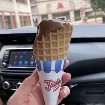 The Parlour - Vegan chocolate ice cream with waffle cone (half eaten) - Ice Cream & Frozen Yogurt Near Me - Durham, North Carolina