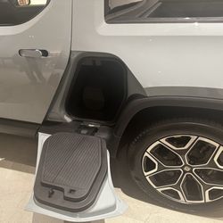 Rivian - Extra storage with step bench.