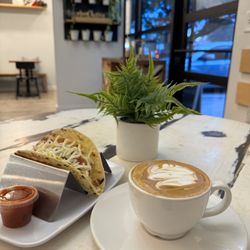 Blockhouse Coffee & Kitchen - Flat white and breakfast taco with bacon