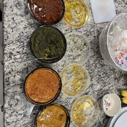 Top to bottom: Lamb vindaloo, Palak Paneer (spinach and cheese), Chicken Tikka Masala, Butter Chicken Top to bottom: Lamb vindaloo, Palak Paneer (spinach and cheese), Chicken Tikka Masala, Butter Chicken