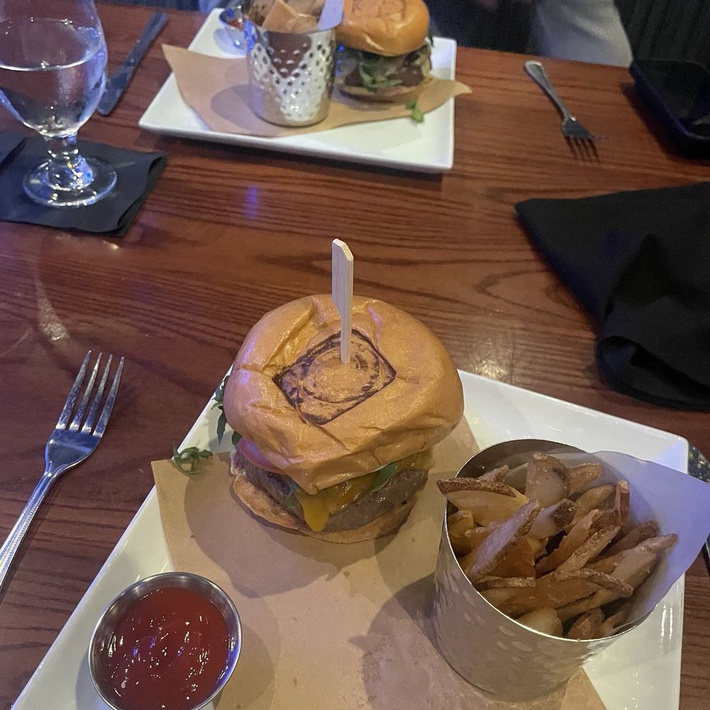 Ocean 302 - Bison burger (farther back in photo from specials menu) and 302 burger with added bacon (closer in photo and from regular menu) - New American Near Me - Melbourne Beach, Florida Ocean 302 - Bison burger (farther back in photo from specials menu) and 302 burger with added bacon (closer in photo and from regular menu) - New American Near Me - Melbourne Beach, Florida