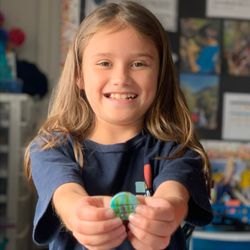 Elevate School - 3rd Graders created life cycle artwork, a collaborative clay model of an animal with their conservation club, & designed awareness buttons.