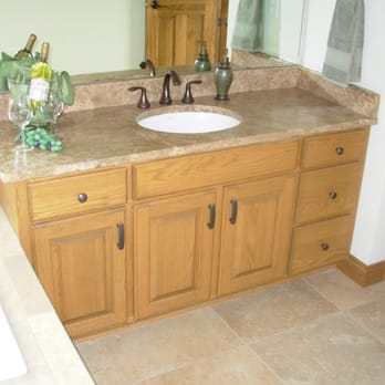 Kanneberg Custom Kitchens - a bathroom with a sink and mirror - General Contractors Near Me - Machesney Park, Illinois Kanneberg Custom Kitchens - a bathroom with a sink and mirror - General Contractors Near Me - Machesney Park, Illinois