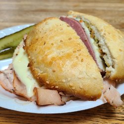 K K's Catering & Deli - The muffalettas are expensive and huge you get what you pay for :-)