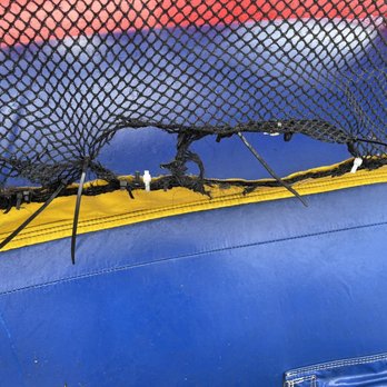 Oak Lawn Party Rentals - Ripped net and fixed with sharp ties - Bounce House Rentals Near Me - Bridgeview, Illinois