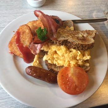 Hobnail Cafe - Hobnail kiwi breakfast - hash browns, bacon, turkey sausage, grilled half tomato and eggs. Generous slather of butter on toast. - Cafes Near Me - Fox Glacier, WTC Hobnail Cafe - Hobnail kiwi breakfast - hash browns, bacon, turkey sausage, grilled half tomato and eggs. Generous slather of butter on toast. - Cafes Near Me - Fox Glacier, WTC