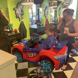 Sharkey's Cuts for Kids - Child in new Spider-Man car