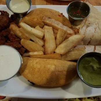 Pollo Rico Latin Bistro - Sampler. Empanadas, quesadillas, fries, hot wings. Pretty good! - Latin American Near Me - Centereach, New York Pollo Rico Latin Bistro - Sampler. Empanadas, quesadillas, fries, hot wings. Pretty good! - Latin American Near Me - Centereach, New York