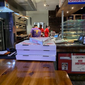 Fat Boys Pizza - Each of these boxes fits only two slices of pizza- they're that big! One slice in the top box - Pizza Near Me - Baton Rouge, Louisiana