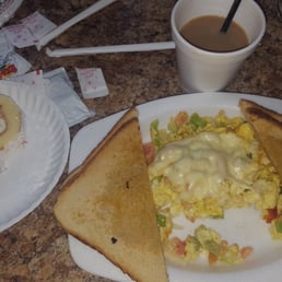 Scrambled eggs with veggies and cheese, coffee, slice of Brazo Gitano- guava cheese amazing!