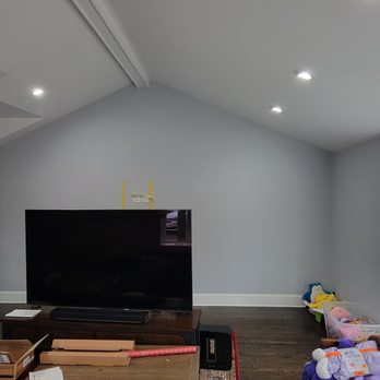 Handy Man Ed - a living room with a flat screen tv - Handyman Near Me Handy Man Ed - a living room with a flat screen tv - Handyman Near Me