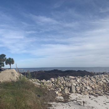 Land Clearing - Crooked Creek Land Development - a large pile of rocks on the beach - General Contractors Near Me - Carrabelle, Florida Land Clearing - Crooked Creek Land Development - a large pile of rocks on the beach - General Contractors Near Me - Carrabelle, Florida