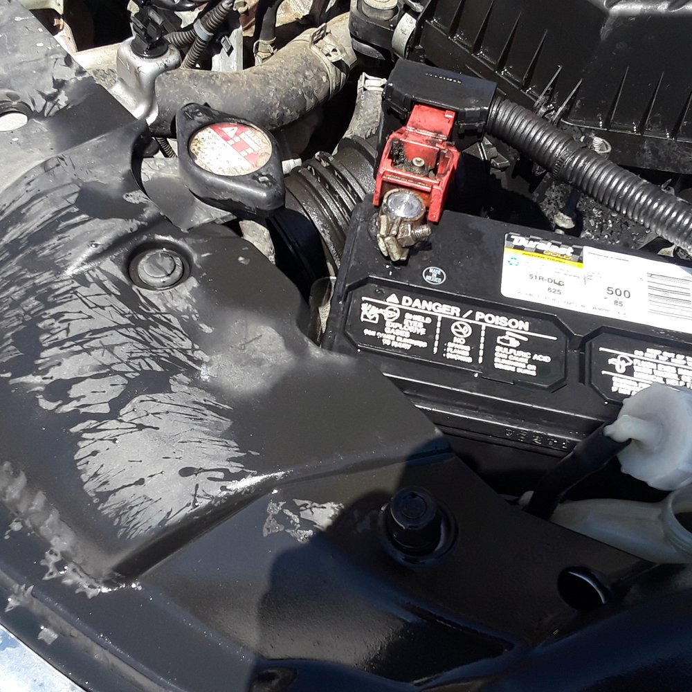 After autozone replaced my battery I drove 15 minutes home to this. Coolant all over the place and coolant reservoir cap  open.