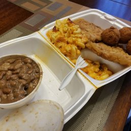 Butterfly Pork Chop mac-n-cheese and pinto beans with hushpuppiees Butterfly Pork Chop mac-n-cheese and pinto beans with hushpuppiees