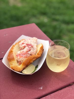 Photo of Belkin Family Lookout Farm - South Natick, MA, US. a lobster sandwich and a glass of wine