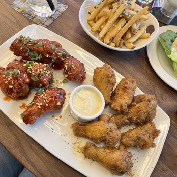 Yard House - 12 Crispy Traditional Wings, Parmesan Truffle Fries - New American Near Me - New York, New York