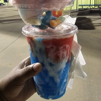 Sips N Swirlz - Tiger Berry Swirlz Slushy top with gummies and cotton candy at Regions Field - Food Trucks Near Me Sips N Swirlz - Tiger Berry Swirlz Slushy top with gummies and cotton candy at Regions Field - Food Trucks Near Me