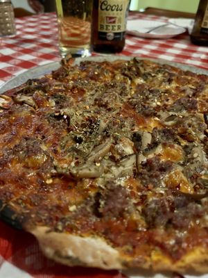 Photo of Fricano's Pizza Tavern - Grand Haven, MI, US. Sausage and mushroom well done with copious amounts of red pepper