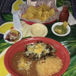 Plaza Jalisco - Steak fondido served with rice and beans.