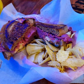 Grinder's Restaurant - Reuben Sandwich with chips and a pickle spear - American Near Me - Lancaster, South Carolina Grinder's Restaurant - Reuben Sandwich with chips and a pickle spear - American Near Me - Lancaster, South Carolina