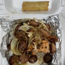 Salmon, sausage, rice platter with an egg roll