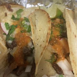 La Chiquita Mexican Grocery Store - Lengua tacos with their salsa. Pretty certain it is habanero. Soooo tasty.