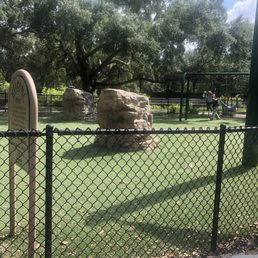 2nd playground area that's fenced in with large boulders for climbing