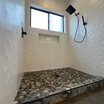 E & J Tile and Stone Creations - Custom shower with pebble Stone wrapped curb match the concrete flooring - General Contractors Near Me - Citrus Heights, California E & J Tile and Stone Creations - Custom shower with pebble Stone wrapped curb match the concrete flooring - General Contractors Near Me - Citrus Heights, California