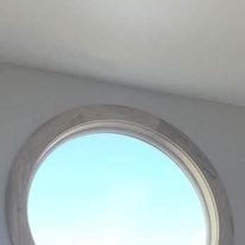 DaSilva Construction - a round window in a bathroom - General Contractors Near Me DaSilva Construction - a round window in a bathroom - General Contractors Near Me