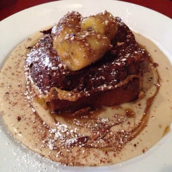 Perly's - Cinnamon French toast with banana and rich creamy caramel syrup topped with crushed baked pecan - Delis Near Me - Richmond, Virginia