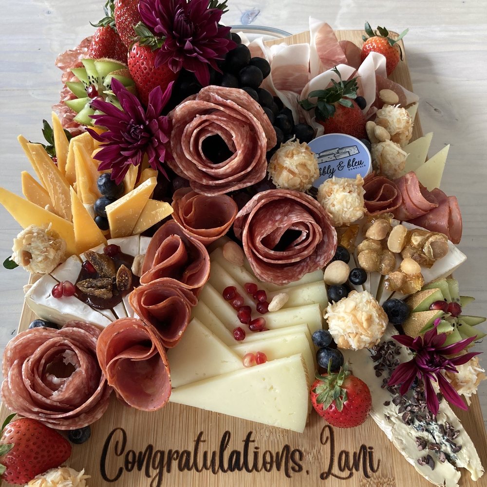 Bubbly & Bleu - This was a personalized mezzo board with a name engraved. It was so beautifully done and pleasing to the eyes as well as the palate later. - Cheese Shops Near Me - Honolulu, Hawaii