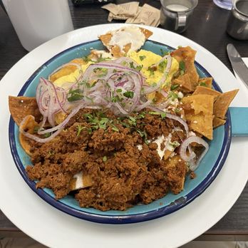 Cups Cafe - Chilaquiles and eggs with the chorizo add - wonderful. - Breakfast & Brunch Near Me - Palm Desert, California Cups Cafe - Chilaquiles and eggs with the chorizo add - wonderful. - Breakfast & Brunch Near Me - Palm Desert, California