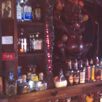 Tradewinds Tropical Lounge & Grill - Bar Area...maybe they'll let you rub his belly? But watch out, it ain't no Buddha! - Bars Near Me - Saint Augustine, Florida
