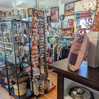 Antique & Chic Winfield - Interior of an antique and vintage shop with shelves and racks displaying collectibles, toys, and memorabilia. - Antiques Near Me - Winfield, Illinois