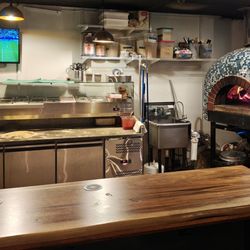 Pizza making station and oven
