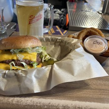 Sandy's Tavern - Their play on a Big Mac with a side of onion rings - Pubs Near Me - Richfield, Minnesota