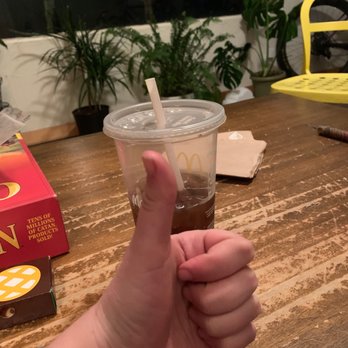 McDonald's - a hand holding a cup of coffee - Fast Food Near Me - Moab, Utah