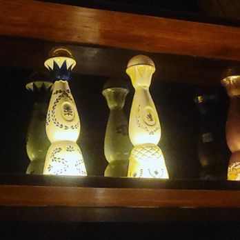 CASE Chocolates - The tequilas display used for the amazing cocktails to compliment the exquisite chocolates. - Speakeasies Near Me - Houston, Texas