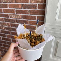 Popcorn chicken in front of the garage door