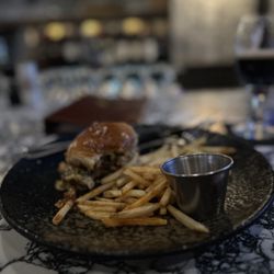 Jack Rose Social Club and Casino - A burger with fries and a side of ketchup