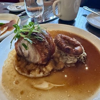 The Dorset - ROAST PORK BELLY  black pepper swede, savoy cabbage, shallot tatin, herb & five-spice sauce - British Near Me - Toronto, Ontario
