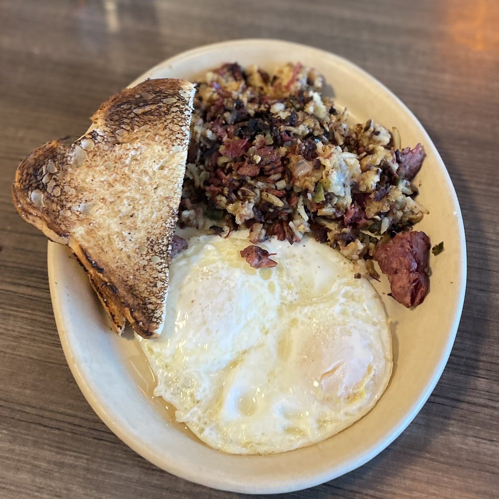 Snooze, an A.M. Eatery - Corned beef and hash w eggs over easy and sourdough ($13) 5/2023 - Breakfast & Brunch Near Me - Tucson, Arizona Snooze, an A.M. Eatery - Corned beef and hash w eggs over easy and sourdough ($13) 5/2023 - Breakfast & Brunch Near Me - Tucson, Arizona