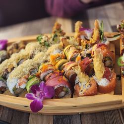 Hana Sushi - All our 6 rolls, beautiful display in boat.