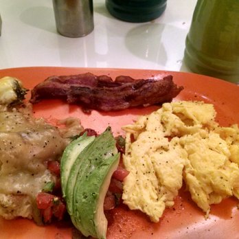 The Local - Tamale with green gravy and eggs. - American Near Me - Prescott, Arizona The Local - Tamale with green gravy and eggs. - American Near Me - Prescott, Arizona